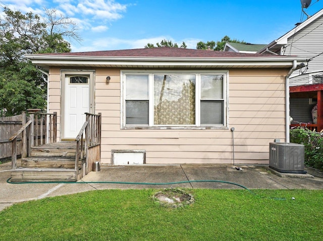 2758 N Newcastle Ave, Chicago, IL 60707 - back of property featuring a patio area, a lawn, and central AC