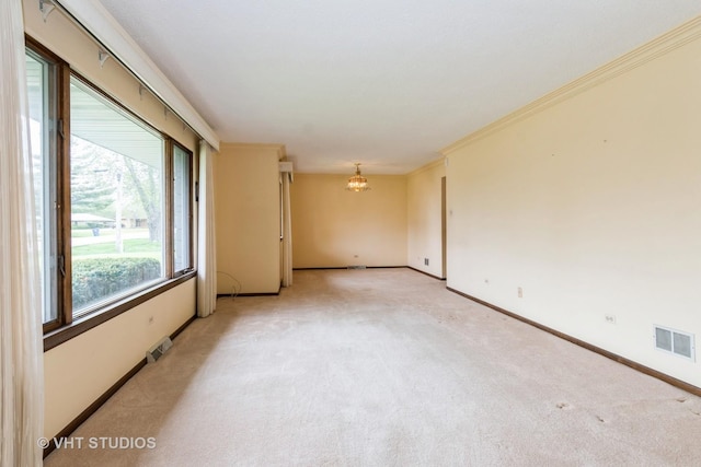 unfurnished room with a chandelier, baseboards, visible vents, and light carpet