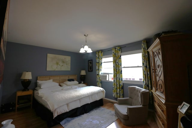 2016 Horeb Ave, Zion, IL 60099 - bedroom with baseboards, wood finished floors, and an inviting chandelier