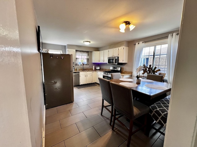 7971 S Kostner Ave, Chicago, IL 60652 - kitchen with plenty of natural light, a sink, white cabinetry, and appliances with stainless steel finishes