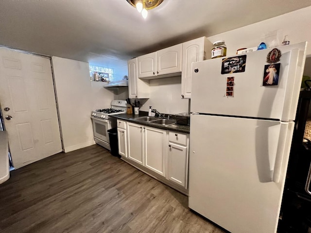 7971 S Kostner Ave, Chicago, IL 60652 - kitchen featuring dark countertops, a sink, white appliances, white cabinets, and dark wood-type flooring