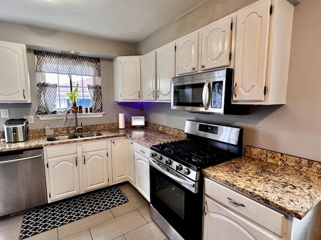 7971 S Kostner Ave, Chicago, IL 60652 - kitchen with white cabinets, light tile patterned floors, stainless steel appliances, and a sink