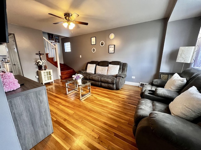7971 S Kostner Ave, Chicago, IL 60652 - living room with light wood finished floors, visible vents, a ceiling fan, and stairs