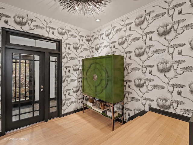 1343 N Sutton Pl, Chicago, IL 60610 - foyer with wallpapered walls, wood finished floors, crown molding, baseboards, and recessed lighting