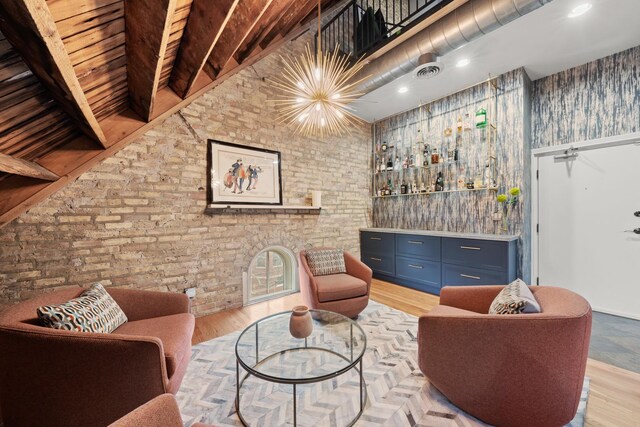 1547 N Leavitt St Unit 3S, Chicago, IL 60622 - living area featuring visible vents, light wood finished floors, a dry bar, and brick wall