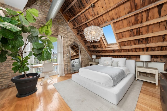 1547 N Leavitt St Unit 3S, Chicago, IL 60622 - bedroom with high vaulted ceiling, wood finished floors, brick wall, beamed ceiling, and wooden ceiling