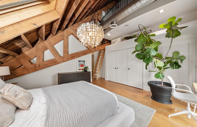 1547 N Leavitt St Unit 3S, Chicago, IL 60622 - bedroom with wood finished floors, recessed lighting, a chandelier, and a closet