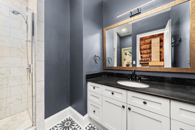 1547 N Leavitt St Unit 3S, Chicago, IL 60622 - bathroom with baseboards, vanity, tile patterned flooring, and a stall shower