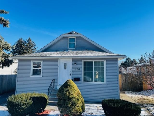 1218 Highland Ave, Joliet, IL 60435 - bungalow featuring fence and roof with shingles