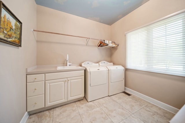5632 Fairview Ave, Downers Grove, IL 60516 - washroom with washer and clothes dryer, cabinet space, light tile patterned flooring, and baseboards