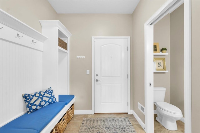 mudroom featuring visible vents and light tile patterned floors