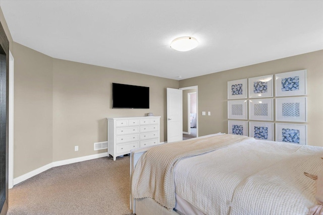 bedroom with baseboards, carpet, and visible vents