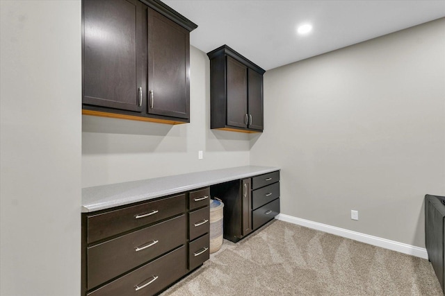 unfurnished office with light colored carpet and baseboards