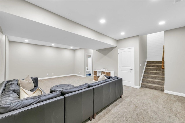 living room with baseboards, recessed lighting, stairs, and light carpet