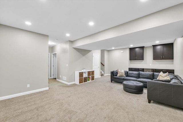 living area featuring light colored carpet, recessed lighting, stairs, and baseboards