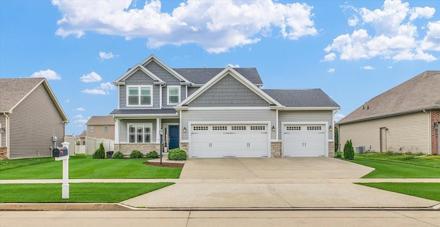 craftsman house featuring driveway, a front lawn, stone siding, and a garage