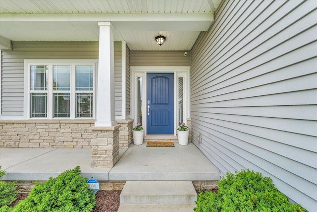 view of exterior entry with stone siding