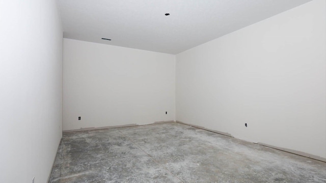 empty room featuring unfinished concrete flooring