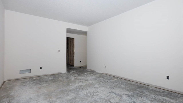 empty room with unfinished concrete floors