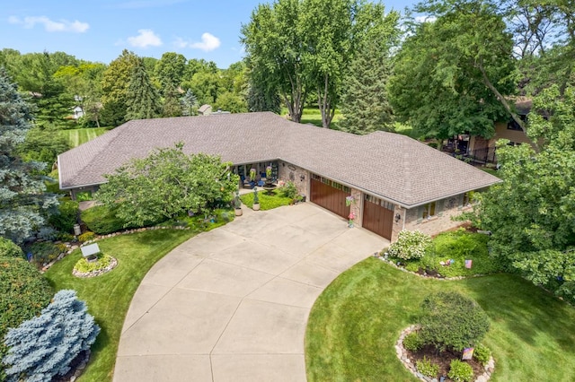 13N430 Chisholm Trl, Elgin, IL 60124 - view of front of house featuring an attached garage, driveway, and a front lawn