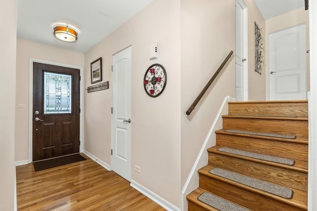 736 Willow Rd, Naperville, IL 60540 - entryway featuring stairway, baseboards, and light wood finished floors