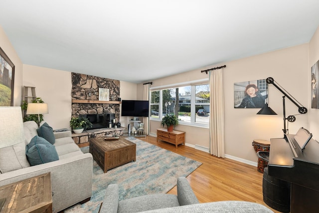 736 Willow Rd, Naperville, IL 60540 - living area featuring light wood-style floors, baseboards, and a fireplace