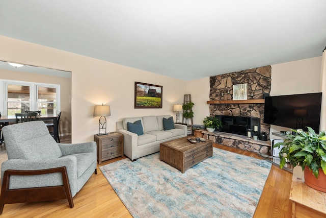 736 Willow Rd, Naperville, IL 60540 - living area featuring a stone fireplace and wood finished floors