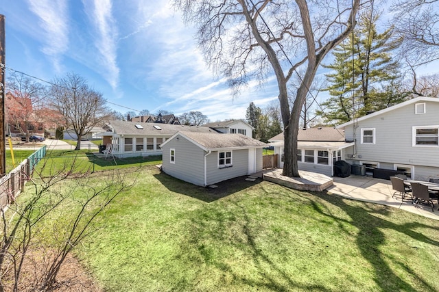 736 Willow Rd, Naperville, IL 60540 - rear view of house featuring a lawn, a fenced backyard, roof with shingles, and a patio