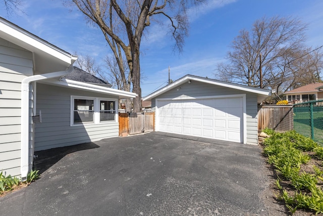 736 Willow Rd, Naperville, IL 60540 - view of property exterior featuring fence, an outdoor structure, and a garage