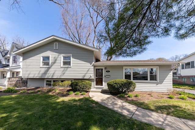 736 Willow Rd, Naperville, IL 60540 - tri-level home with a front lawn and fence