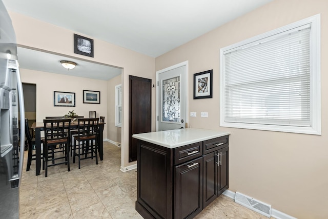 736 Willow Rd, Naperville, IL 60540 - kitchen with light countertops, baseboards, and visible vents