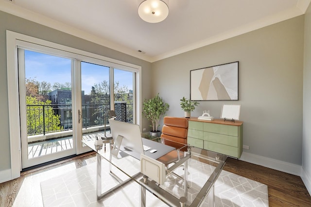 home office with baseboards, wood finished floors, and visible vents