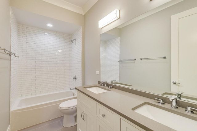 bathroom with a sink, bathing tub / shower combination, tile patterned flooring, and toilet