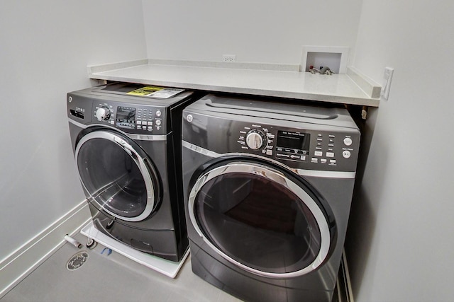 laundry room featuring laundry area and washing machine and dryer