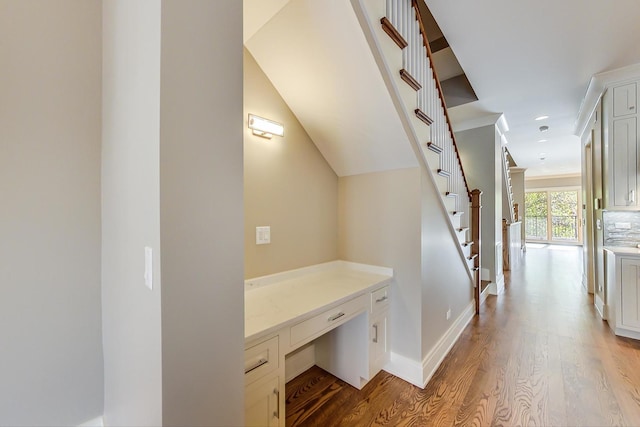 hall with recessed lighting, baseboards, wood finished floors, and stairway