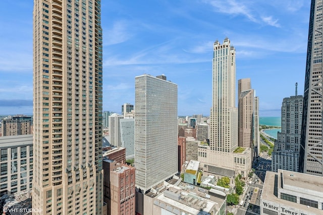 property's view of city featuring a water view