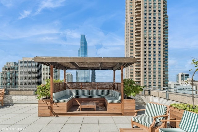 view of patio with a balcony and a city view