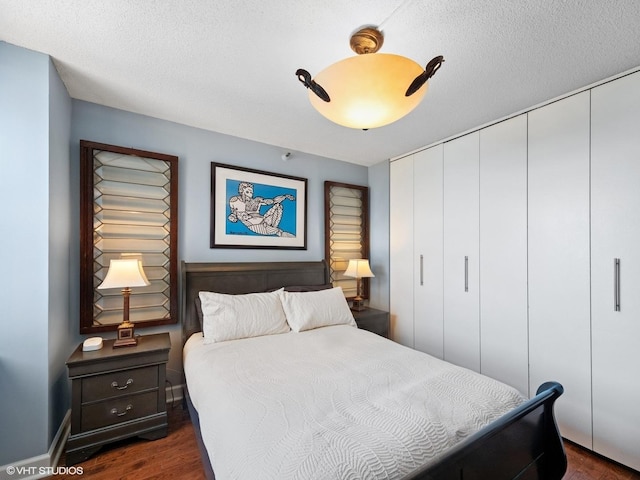 3660 N Lake Shore Dr Unit 3905, Chicago, IL 60613 - bedroom featuring dark wood-style flooring, a closet, and a ceiling fan