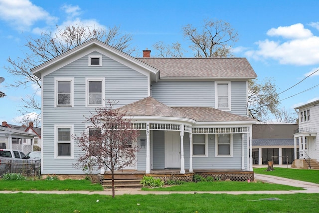 418 E Benton St, Aurora, IL 60505 - view of front facade featuring a porch, a chimney, roof with shingles, and a front lawn