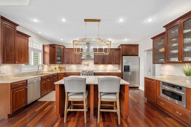 127 60th St, Downers Grove, IL 60516 - kitchen with stainless steel appliances, wall chimney exhaust hood, a sink, decorative backsplash, and recessed lighting