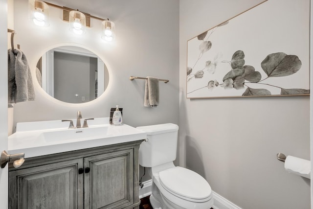 127 60th St, Downers Grove, IL 60516 - half bathroom featuring toilet, vanity, and baseboards