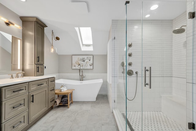 127 60th St, Downers Grove, IL 60516 - bathroom featuring a skylight, tile walls, lofted ceiling, a freestanding bath, and a shower stall