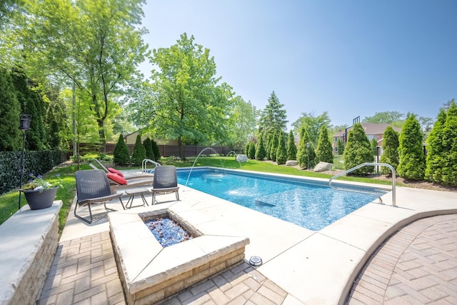 127 60th St, Downers Grove, IL 60516 - view of swimming pool with an outdoor fire pit, a patio area, a fenced backyard, and view of wooded area