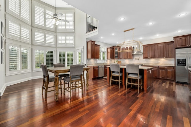 127 60th St, Downers Grove, IL 60516 - dining area with a ceiling fan, plenty of natural light, dark wood-style floors, a towering ceiling, and recessed lighting