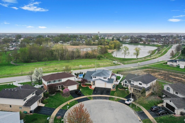 birds eye view of property featuring a water view and a residential view