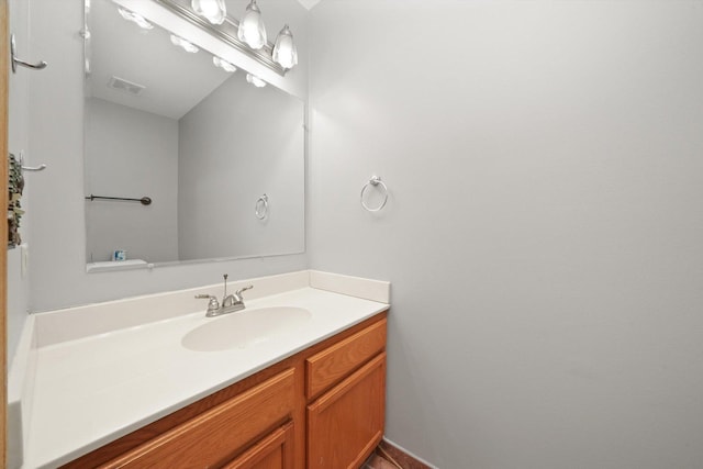 bathroom with visible vents and vanity