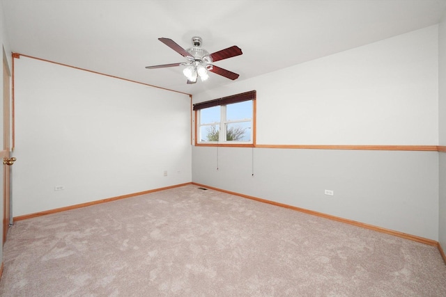 empty room with baseboards, a ceiling fan, and carpet flooring