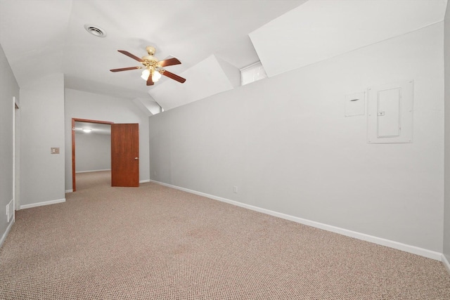 interior space with baseboards, light carpet, a ceiling fan, and lofted ceiling