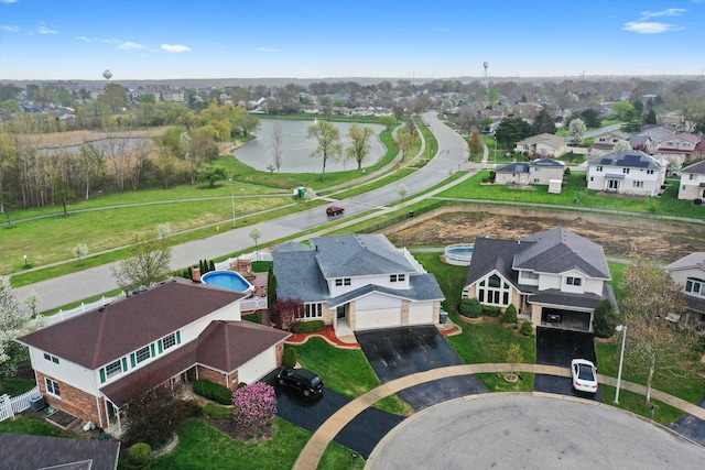 aerial view featuring a water view and a residential view
