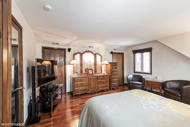 bedroom featuring dark wood-style flooring and visible vents